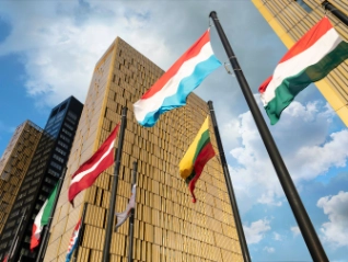 European Flags flapping in the wind, in front of European Union Court of Justice building in Luxembourg Ki