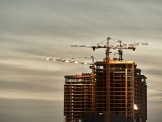 Construction site with crane at dusk