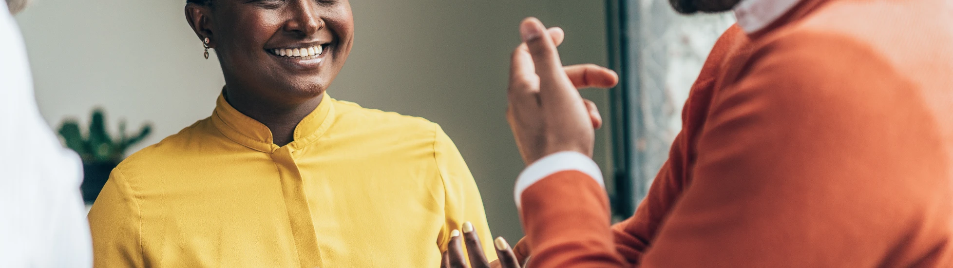 Woman and two men talking