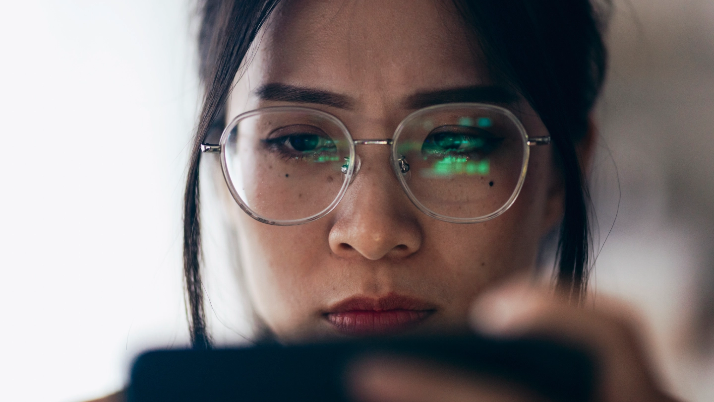 Taiwanese lady inspecting her phone Taiwanese lady inspecting her phone