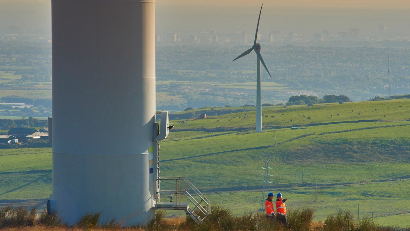 Solar farm workers in a field.jpg Solar farm workers in a field