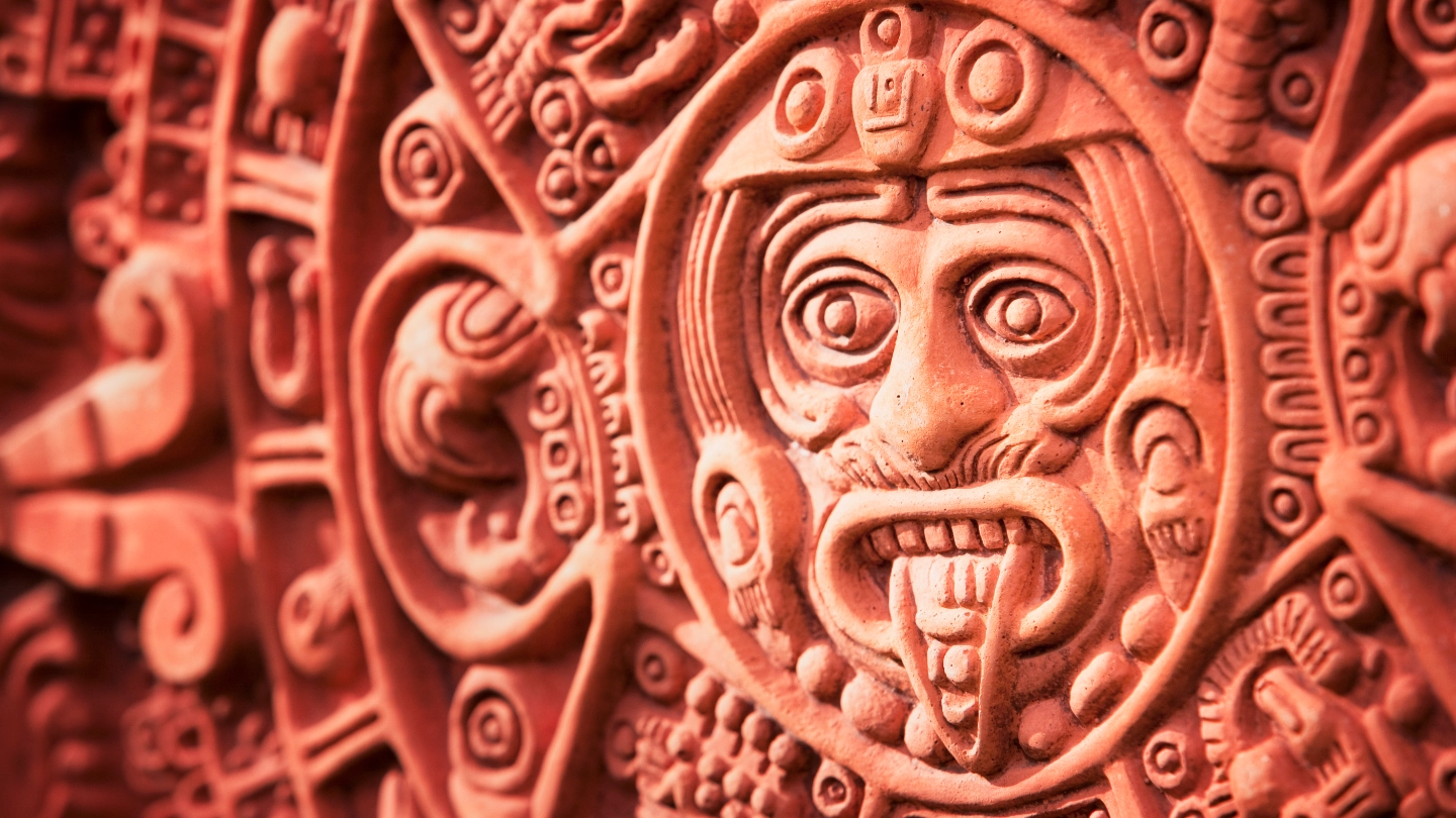 Mexican face carving in a wall Mexican face carving in a wall