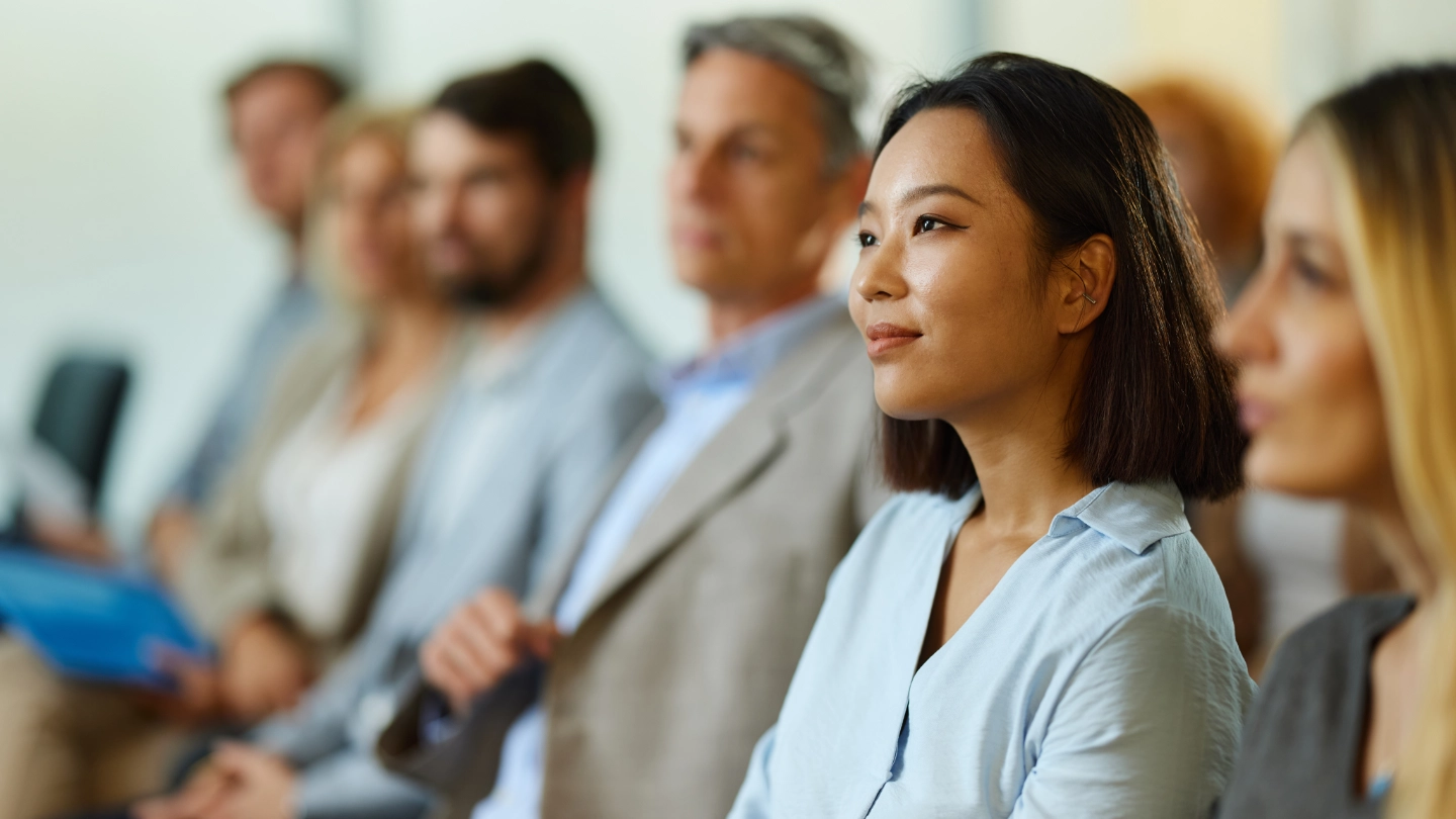 woman in group listening attentively woman in group listening attentively