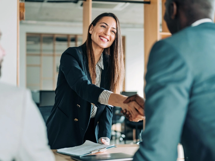 woman-shakes-hand-of-man woman shakes hand of man